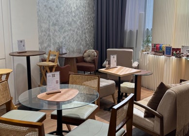Relaxing seating area at Velveté Boutique in Singapore, SG featuring cozy chairs and modern decor.