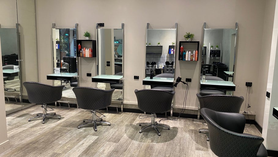 Elegant salon chairs at Vogue Hair&Beauty Salon, Melbourne, Victoria, AU, inviting for a luxurious experience.