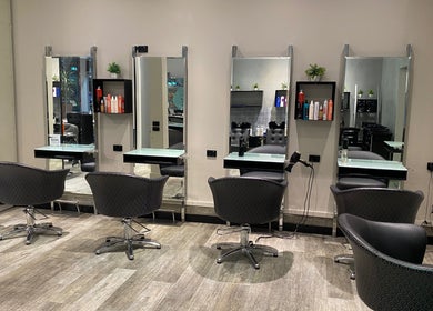 Elegant salon chairs at Vogue Hair&Beauty Salon, Melbourne, Victoria, AU, inviting for a luxurious experience.