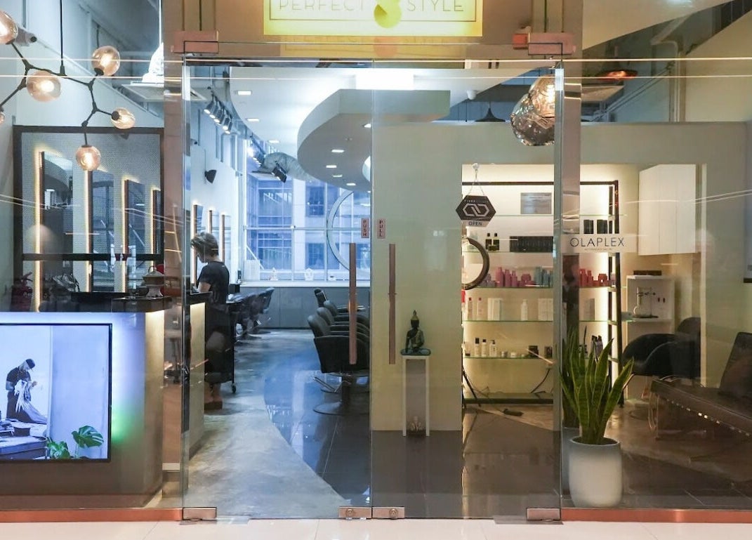 Entrance of Perfect Style Salon in Singapore, showcasing modern decor and welcoming ambiance.