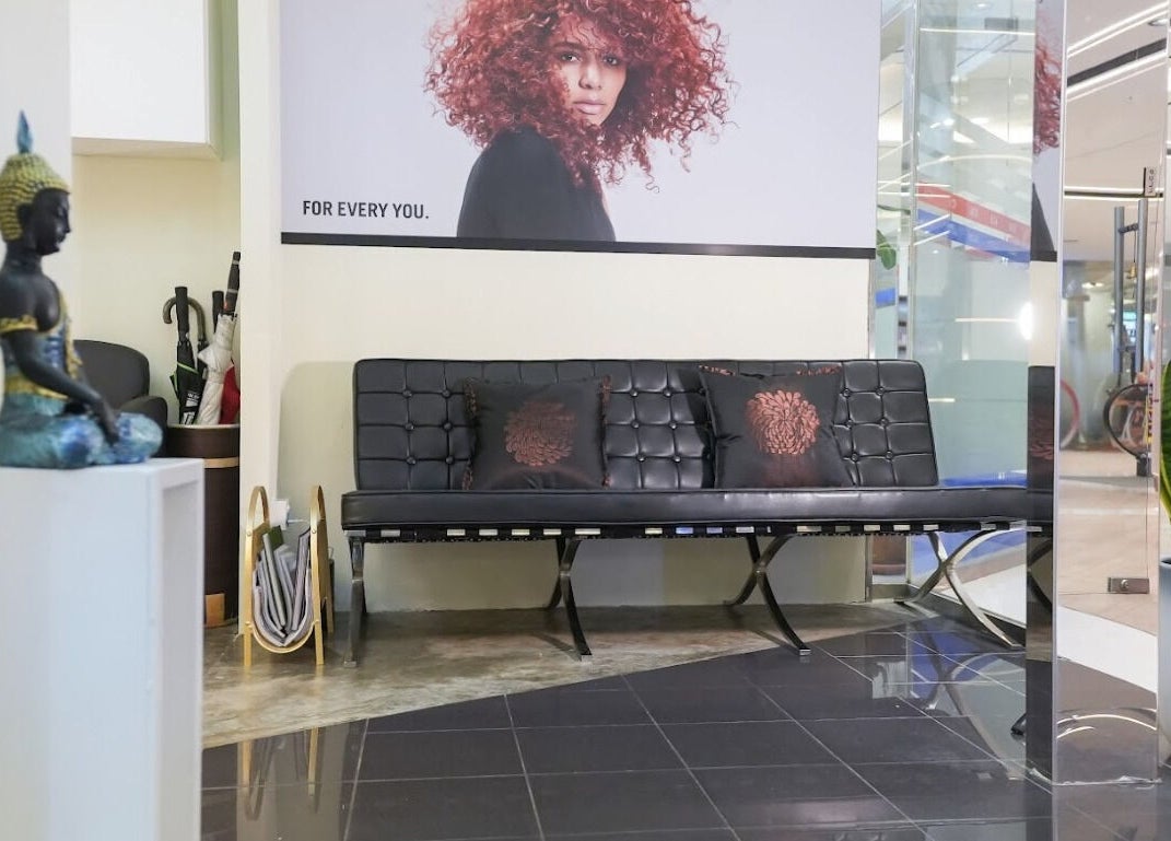 Entrance lounge with black leather seating at Perfect Style Salon, Singapore, Singapore, SG.