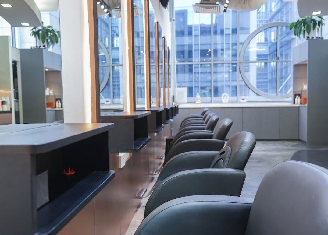 Modern interior of Perfect Style Salon in Singapore, Singapore, SG with sleek styling chairs and mirrors.