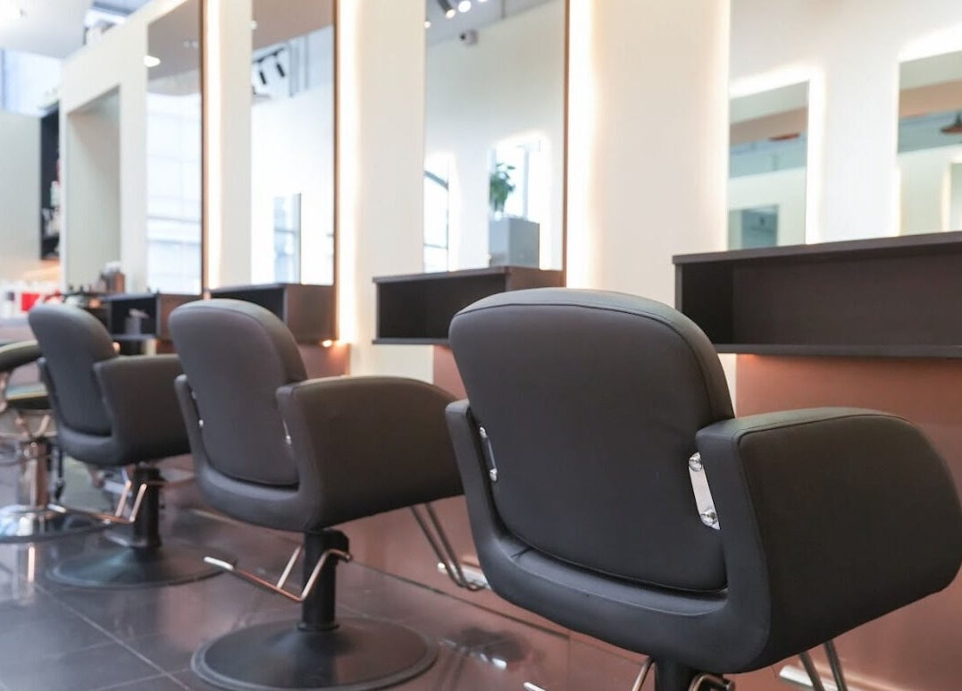 Modern salon chairs and mirrors at Perfect Style Salon, Singapore, SG showcasing sleek design.