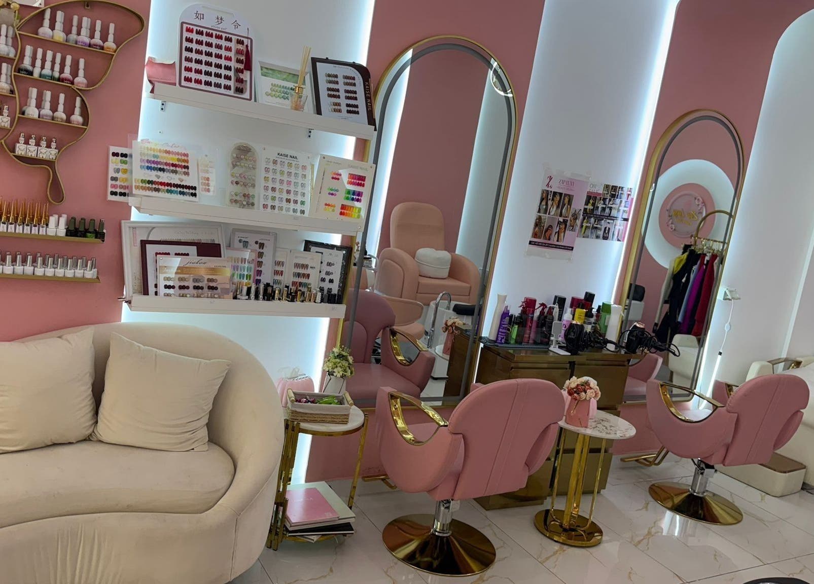 Chic pink-themed interior of Zap Luxy Beauty Salon, Dubai, Dubai, AE, showcasing manicure stations and decor.