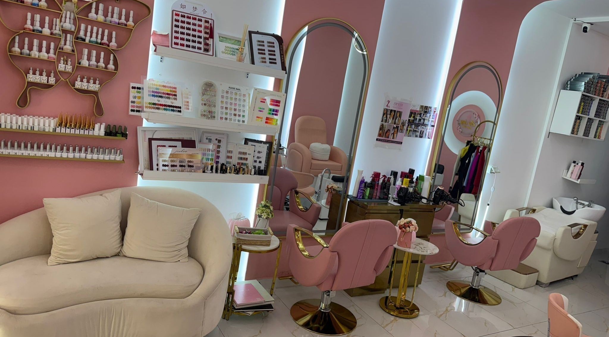Chic pink-themed interior of Zap Luxy Beauty Salon, Dubai, Dubai, AE, showcasing manicure stations and decor.