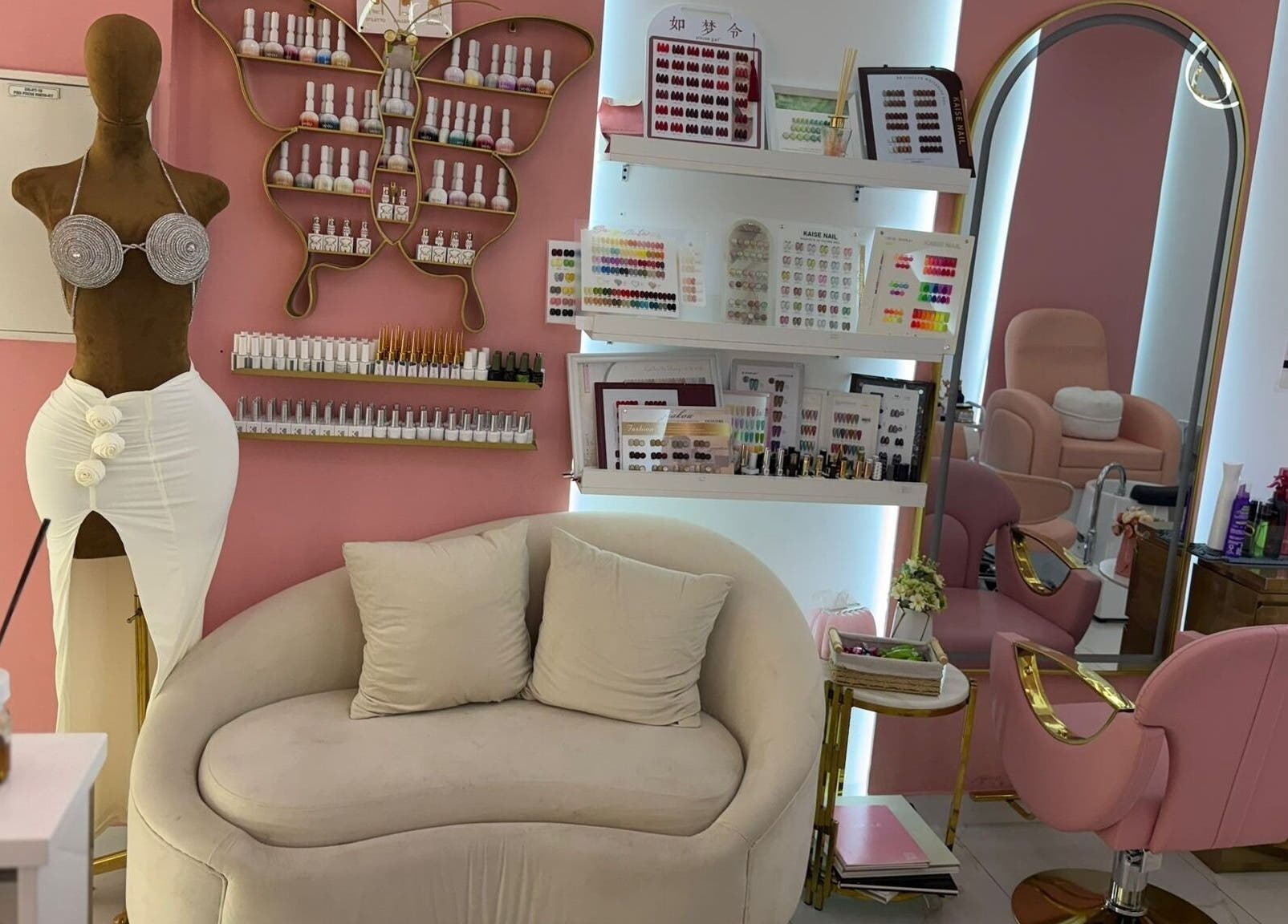 Chic interior of Zap Luxy Beauty Salon, Dubai featuring elegant seating and beauty products on display.