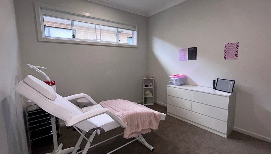 Calm treatment room at Brat Studio, Tahmoor, New South Wales, AU with a comfy chair and minimalist decor.