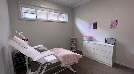 Calm treatment room at Brat Studio, Tahmoor, New South Wales, AU with a comfy chair and minimalist decor.