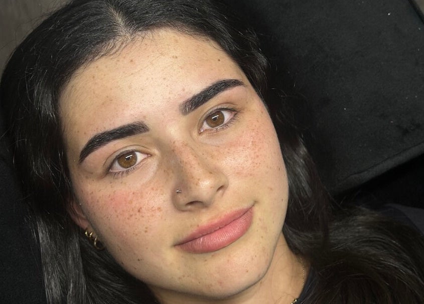 Woman with perfectly sculpted eyebrows at Brat Studio, located in Tahmoor, New South Wales, AU.