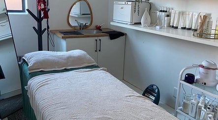 Tranquil treatment room at Mommy Wellness Day Spa Lansdowne, Cape Town, Western Cape, ZA, featuring massage bed.