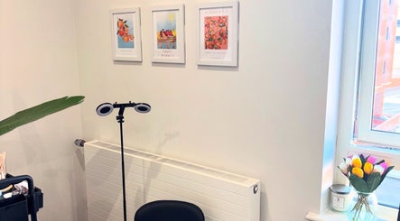 Elegant beauty corner at Brow & Glow Beauty, Hemel Hempstead, England, GB with floral decor.