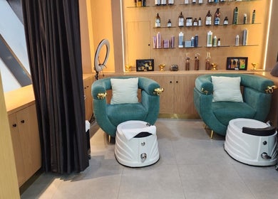 Luxurious pedicure chairs at Slon Street, Abu Dhabi, AE set against a backdrop of premium products.