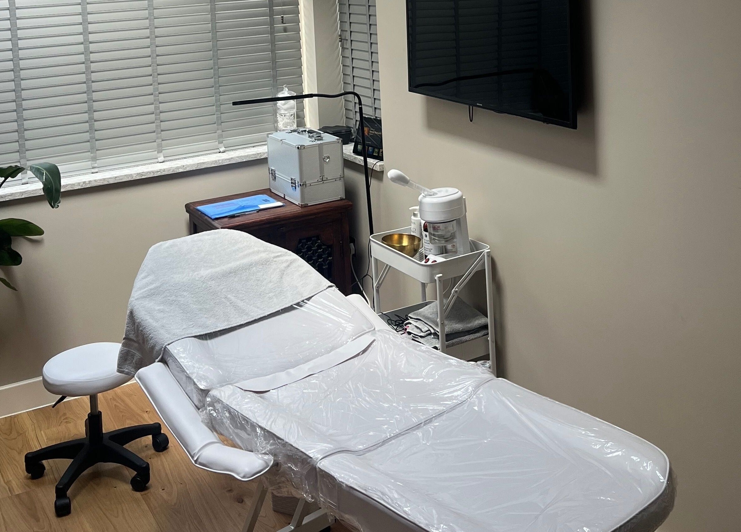 Relaxing treatment room at Skin Clinic By Chloé, Comberton, England, GB offering a serene wellness experience.