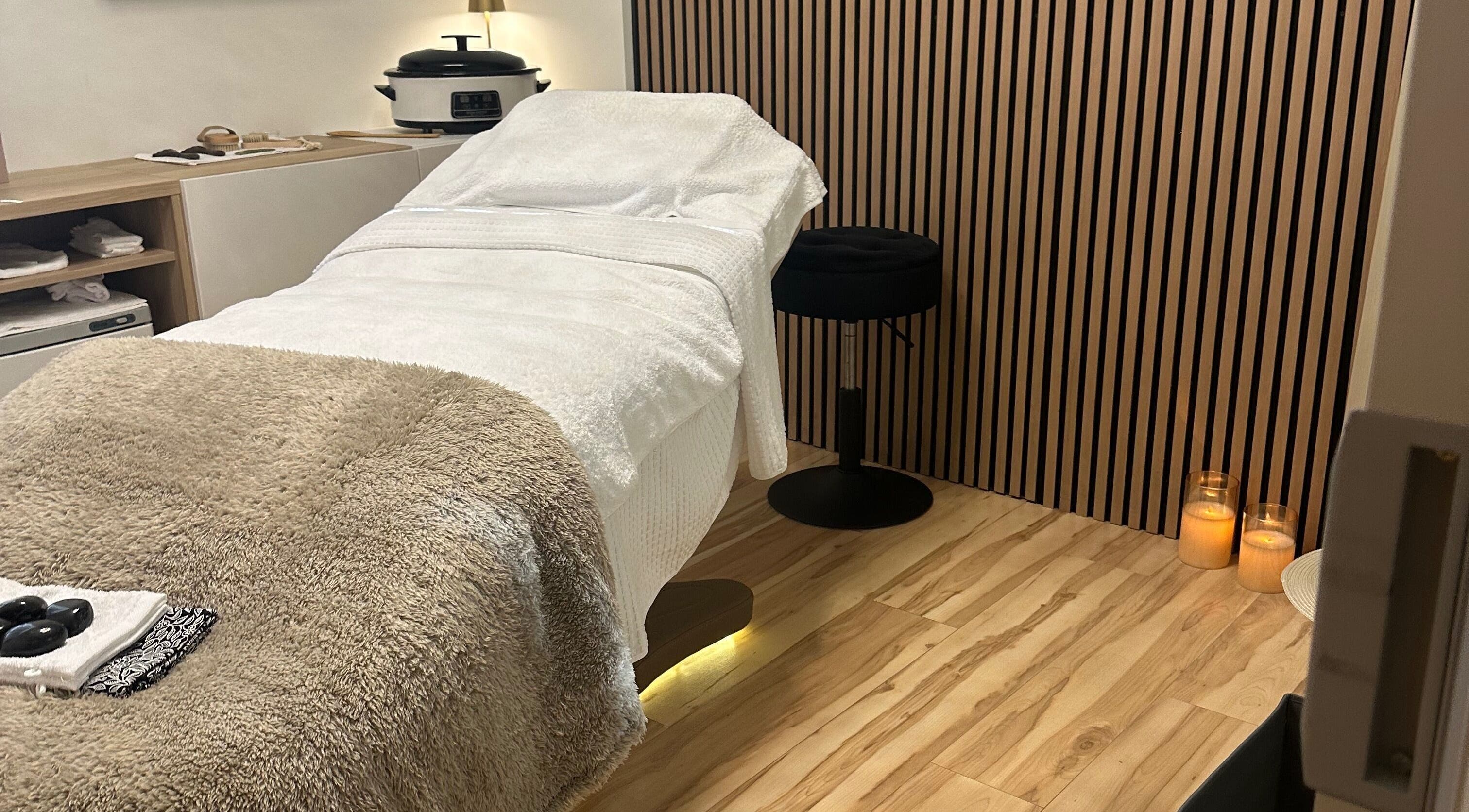Relaxing therapy room at Chakra Advanced Therapies in Plymouth, England, GB featuring a cozy massage table.