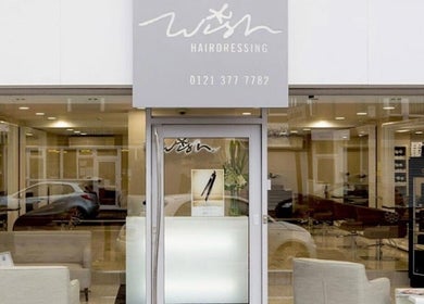 Entrance of OMBrow salon in Birmingham, England, GB showcasing a modern, inviting facade.