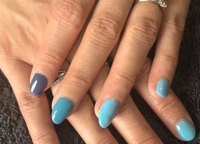 Stylish blue manicure at Polished Nails & Beauty, Worcester, England, GB. Discover vibrant nail art services.