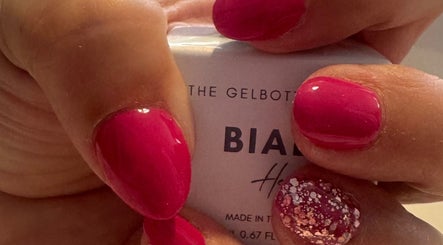 Vibrant red nails with glitter from Polished Nails & Beauty in Worcester, England, GB.