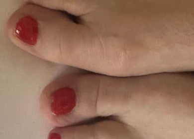 Polished Nails & Beauty toe nails with red polish in Worcester, England, GB, showcasing expert pedicure.