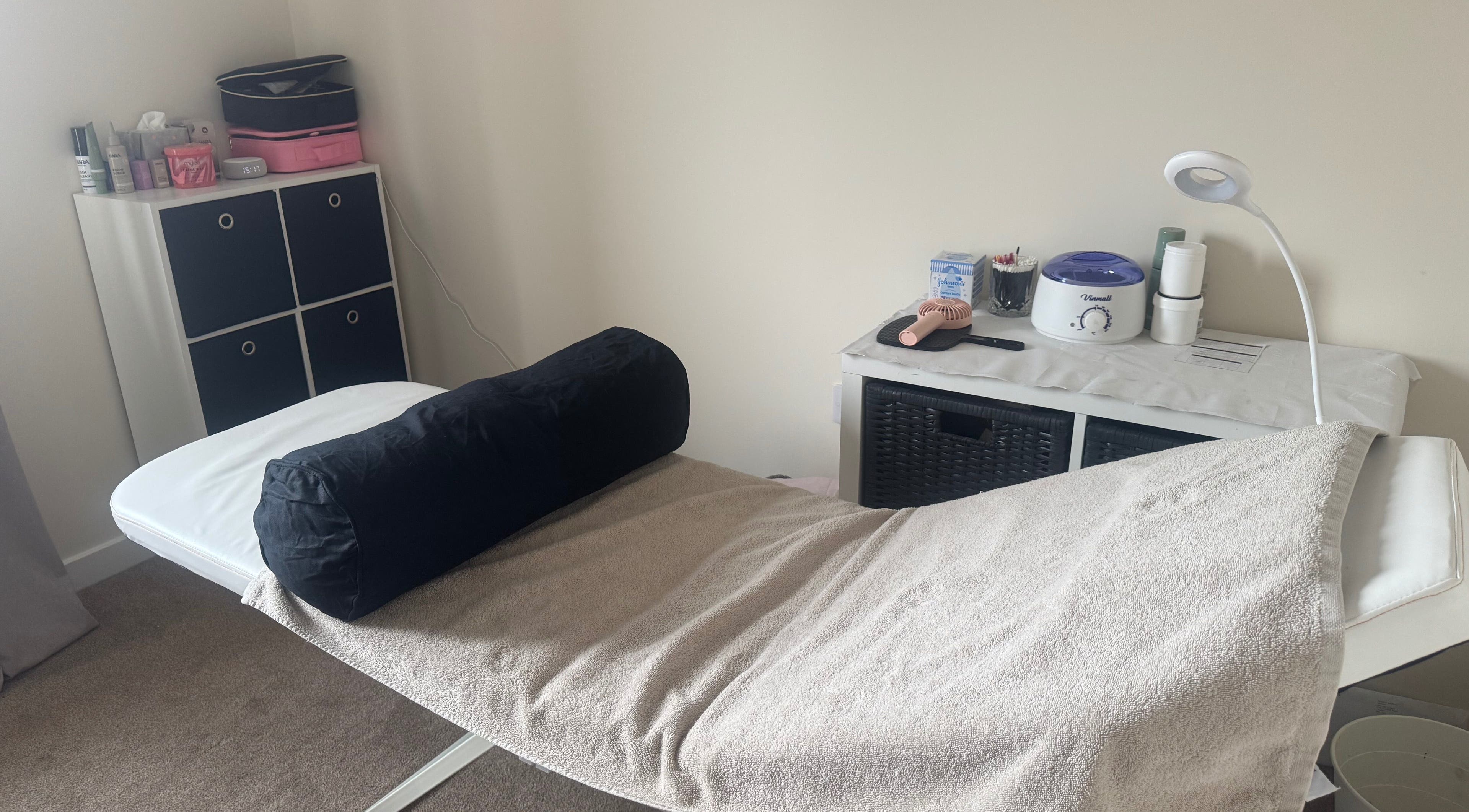 Treatment room at Polished Nails & Beauty in Worcester, GB featuring a comfortable massage bed and tools.