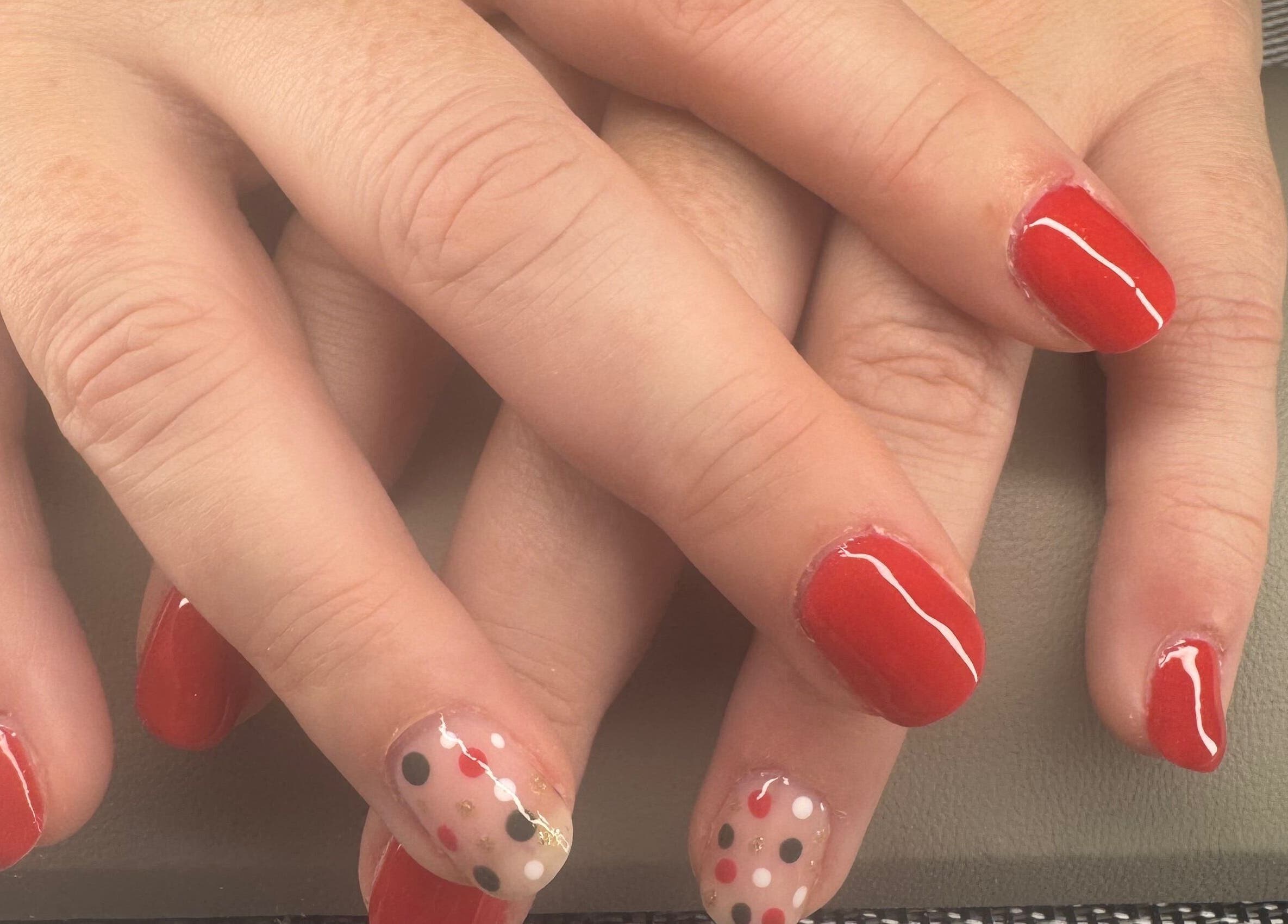 Vibrant red and polka dot nail art at Polished Nails & Beauty, Worcester, GB.
