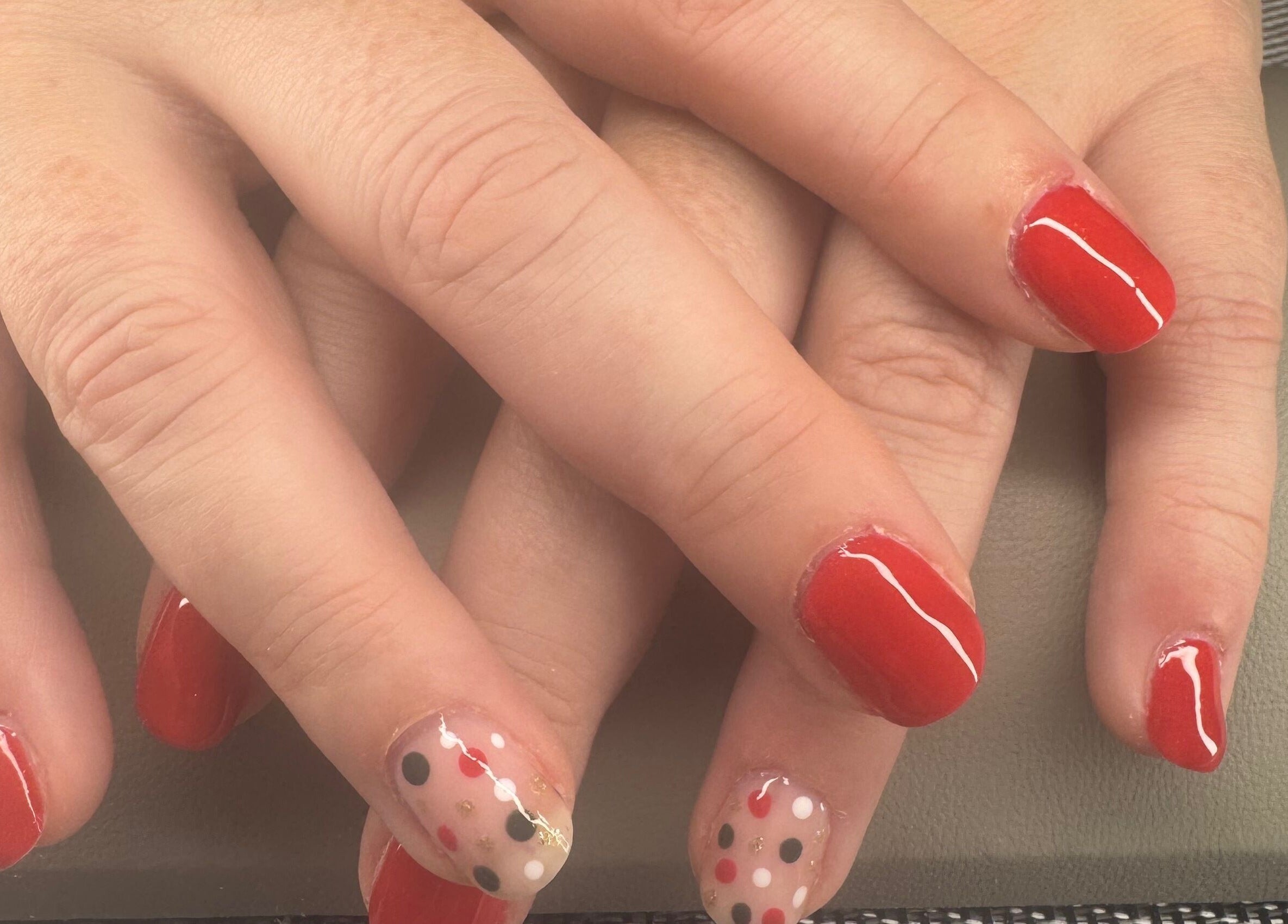 Vibrant red and polka dot nail art at Polished Nails & Beauty, Worcester, GB.