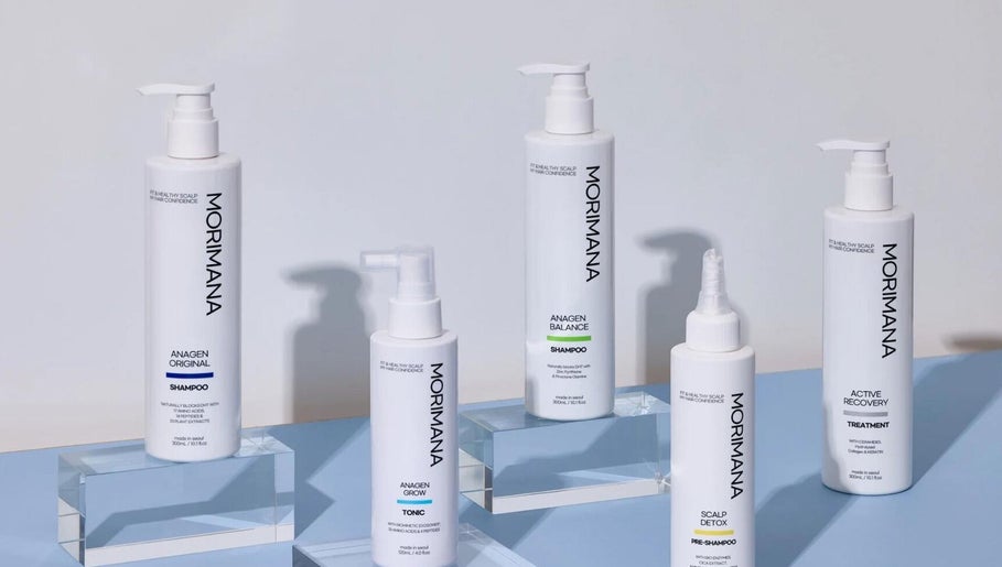 MMSTUDIO | Morimana Studio hair care products displayed on a blue surface in London, England, GB.