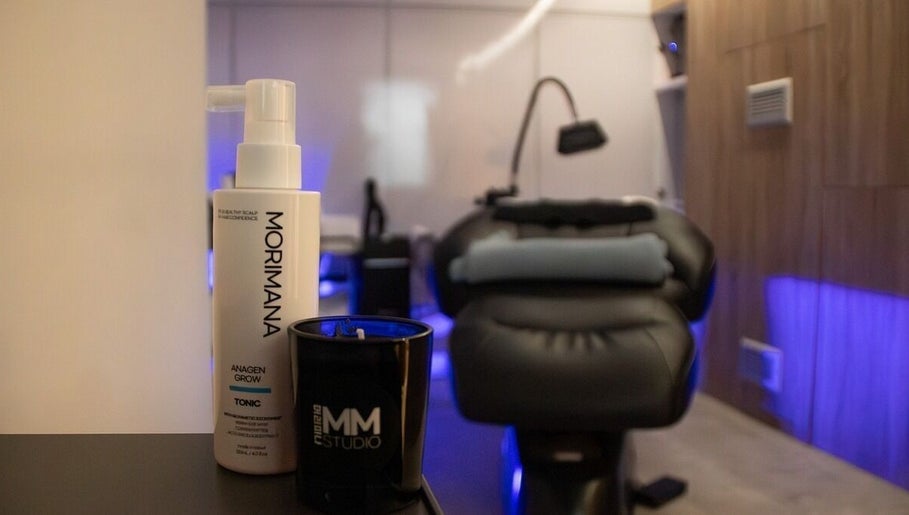 Elegant spa room at MMSTUDIO | Korean Biotech Face & Scalp Programs in London, England, GB with products displayed.