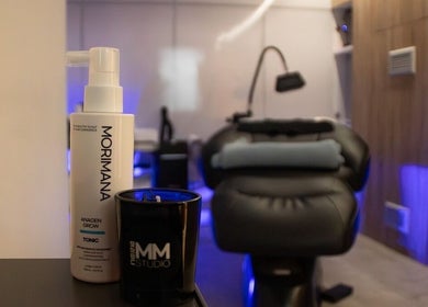 Elegant spa room at MMSTUDIO | Korean Biotech Face & Scalp Programs in London, England, GB with products displayed.
