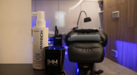 Elegant spa room at MMSTUDIO | Korean Biotech Face & Scalp Programs in London, England, GB with products displayed.