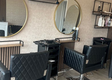 Elegant interior of AZ Hair Salon in Southport, England, GB featuring modern styling chairs and mirrors.