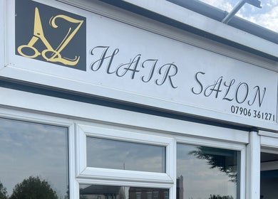 AZ Hair Salon entrance signage at Southport, England, GB showcasing elegant design.