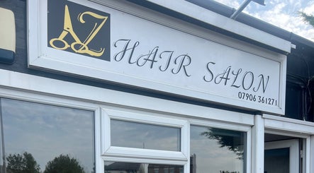 AZ Hair Salon entrance signage at Southport, England, GB showcasing elegant design.