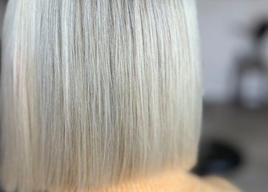 Freshly styled blonde bob at AZ Hair Salon, Southport, England, GB. Smooth, sleek finish for modern elegance.