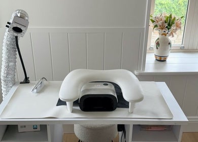 Elegant nail station at Beauty By Mimz, Ludgvan, England, GB showcasing modern equipment and fresh lilies.