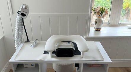 Elegant nail station at Beauty By Mimz, Ludgvan, England, GB showcasing modern equipment and fresh lilies.