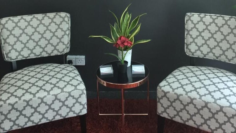 Elegant seating area at Family First Consultancy, Petaling Jaya, Selangor, MY with chairs and a plant.