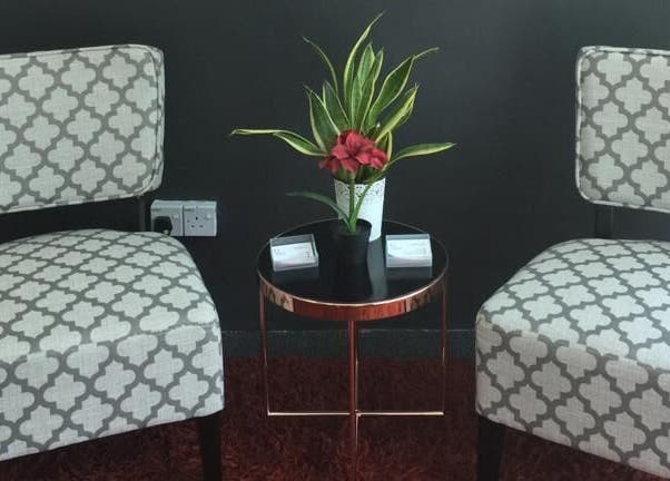 Elegant seating area at Family First Consultancy, Petaling Jaya, Selangor, MY with chairs and a plant.
