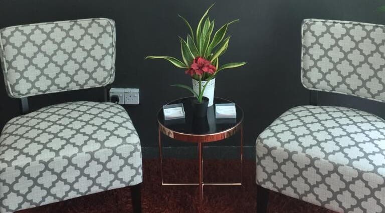 Elegant seating area at Family First Consultancy, Petaling Jaya, Selangor, MY with chairs and a plant.