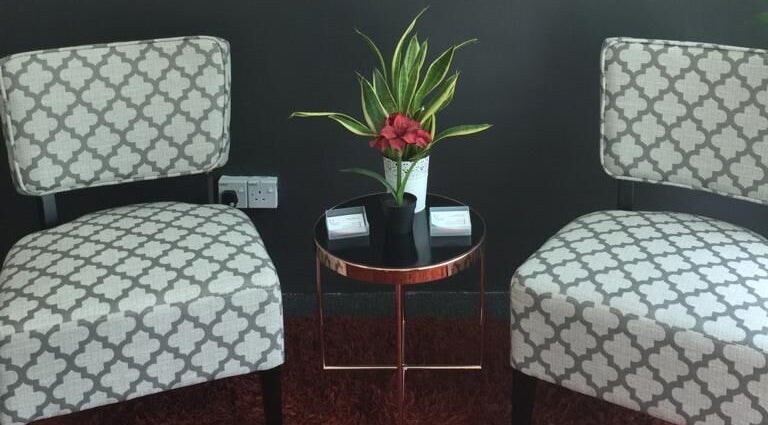 Elegant seating area at Family First Consultancy, Petaling Jaya, Selangor, MY with chairs and a plant.