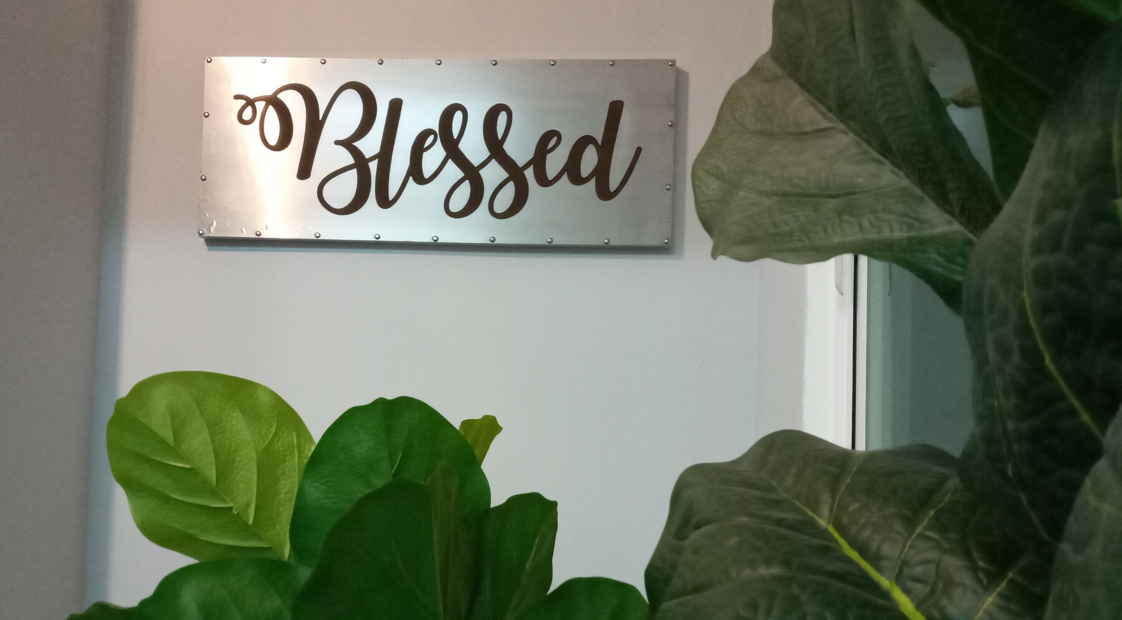 Elegant 'Blessed' sign with lush greenery at Family First Consultancy, Petaling Jaya, Selangor, MY.