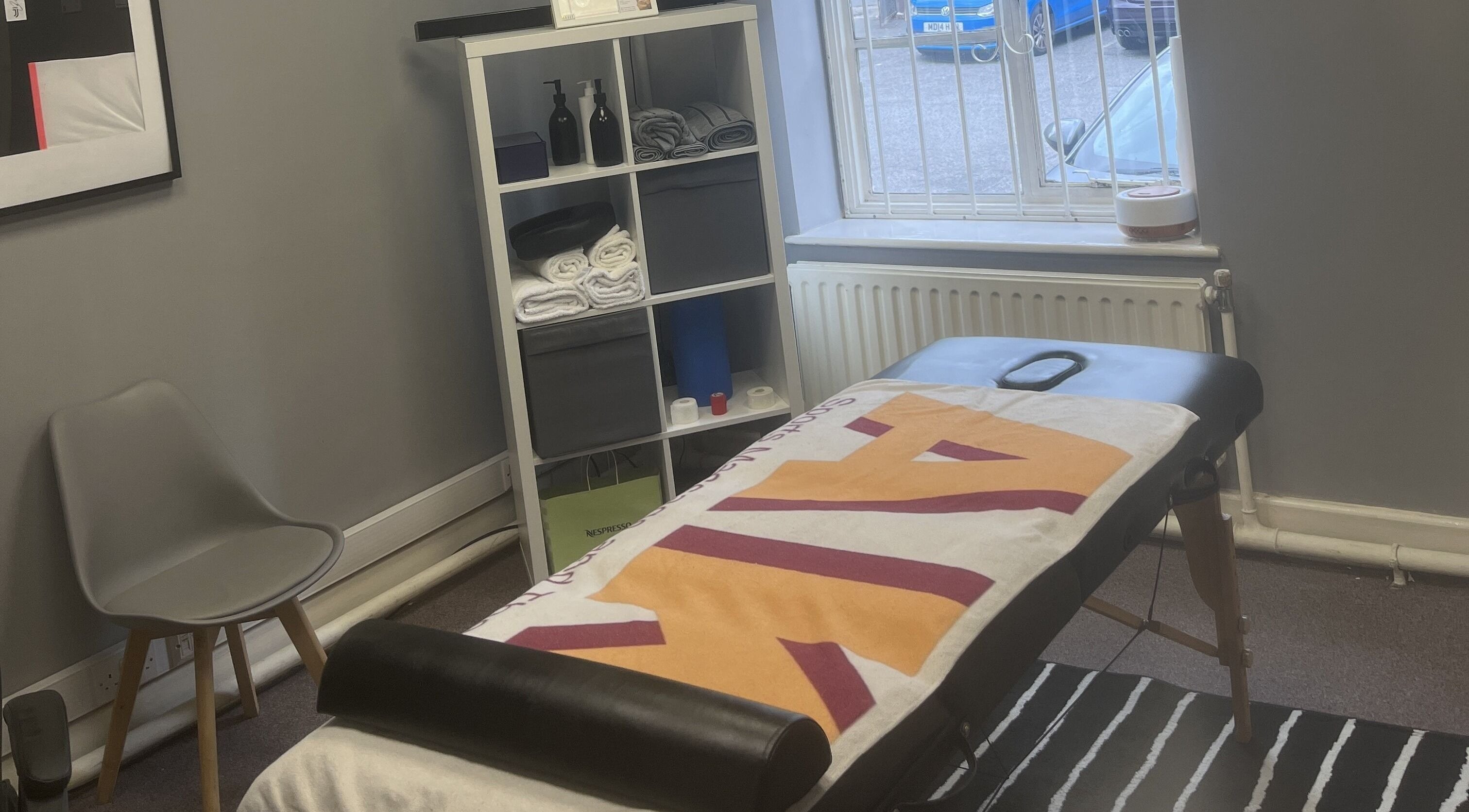 Cozy massage room at AK Sports Massage and Therapy, Cleckheaton, England, GB features a ready massage table.