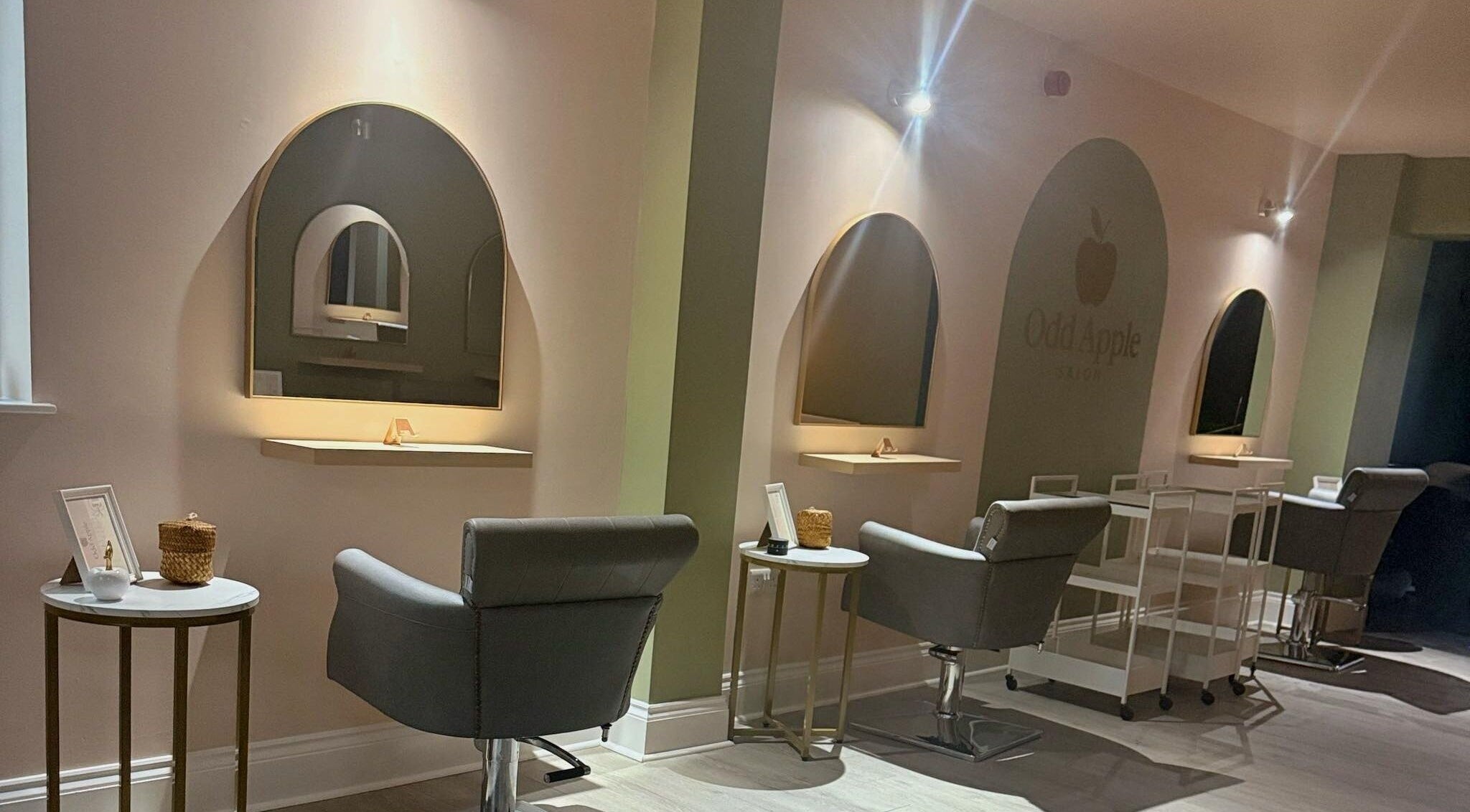 Elegant styling chairs at Odd Apple Salon, Langley Moor, England, GB, showcasing modern design and comfort.