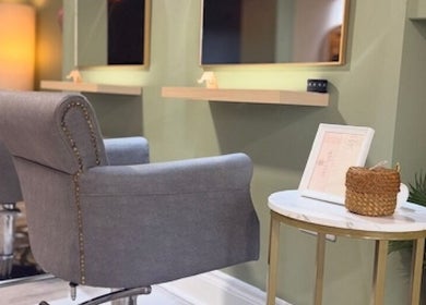 Stylish seating area at Odd Apple Salon, Langley Moor, England, GB with plush chairs and chic decor.