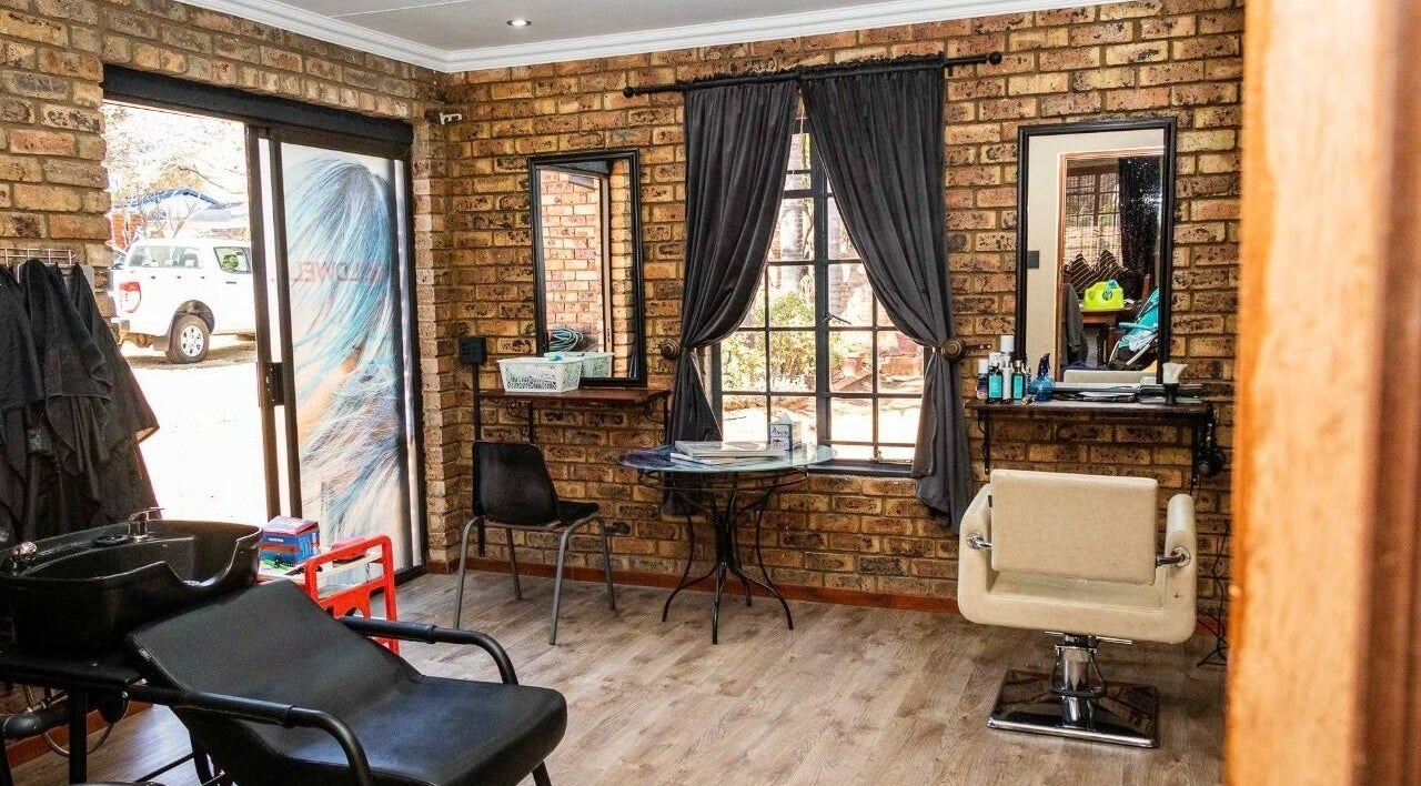 Cozy interior of Hair@Lerina in Centurion, Gauteng, ZA with stylish chairs and mirrors.
