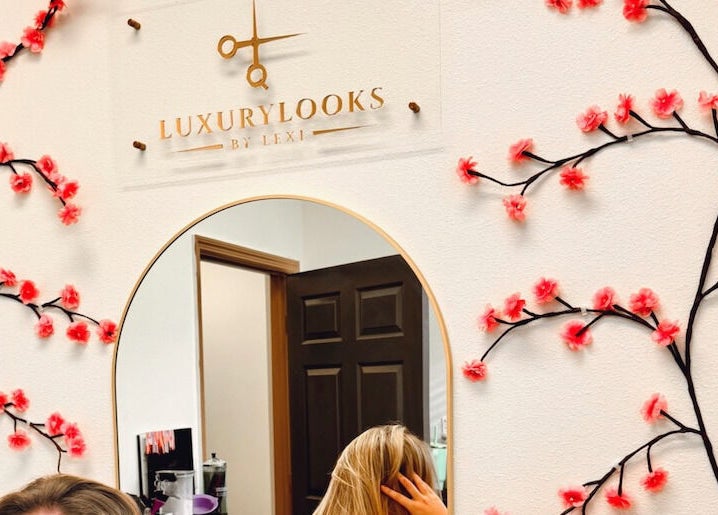 Elegant mirror with floral decor at LuxuryLooksbByLexi, New Port Richey, Florida, US.