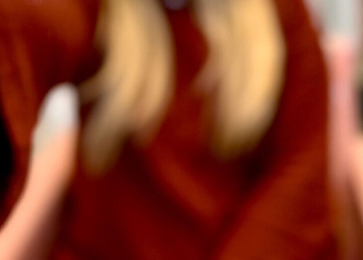 Blonde hair and red sweater detail from LuxuryLooksbByLexi in New Port Richey, Florida, US.