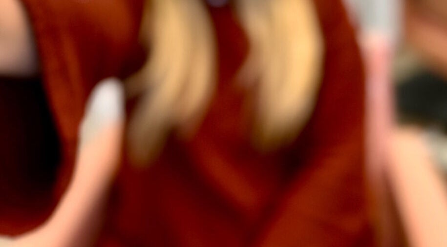 Blonde hair and red sweater detail from LuxuryLooksbByLexi in New Port Richey, Florida, US.