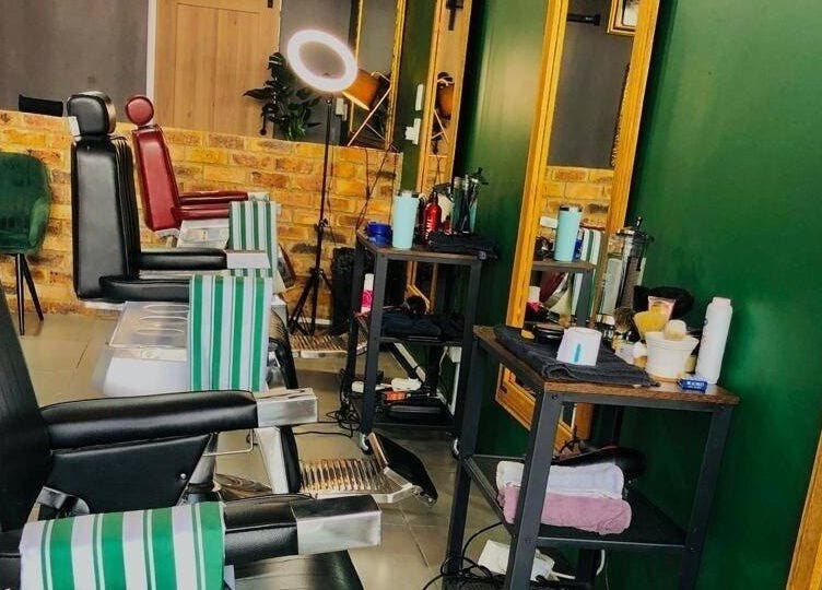 Modern barber chairs at Mike Hairstylist / Barber in Sandton, Gauteng, ZA, showcasing professional styling stations.