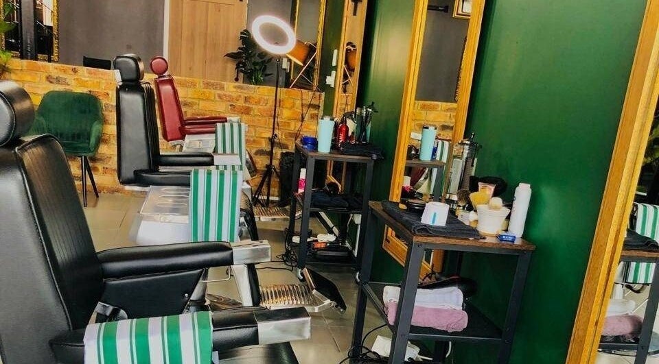 Modern barber chairs at Mike Hairstylist / Barber in Sandton, Gauteng, ZA, showcasing professional styling stations.