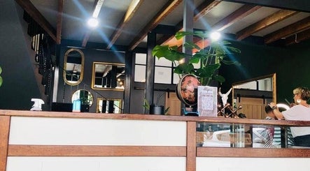 Chic interior of Mike Hairstylist / Barber in Sandton, Gauteng, ZA showcasing modern decor and mirrors.